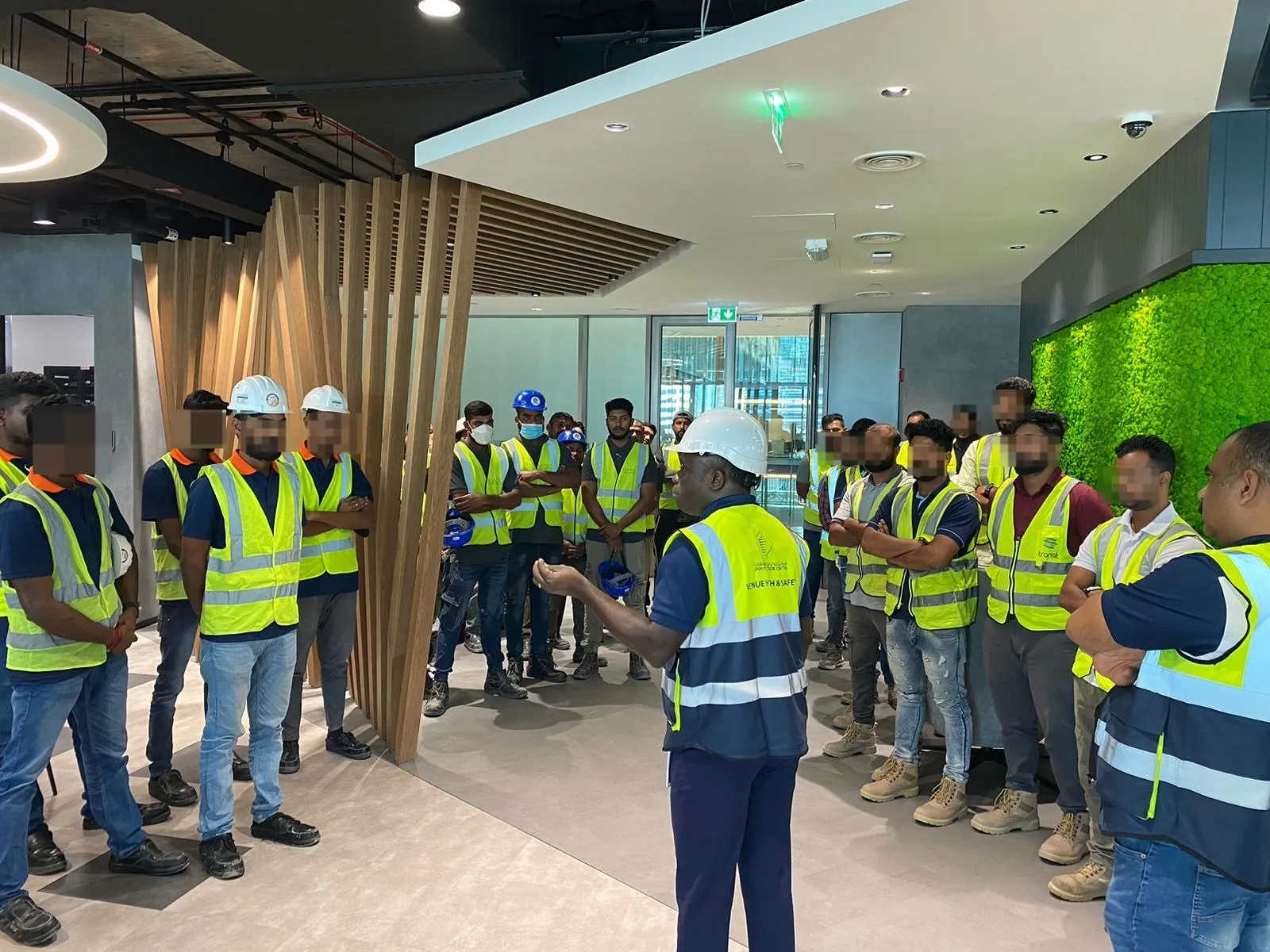 The AIN UAE team reviewing drone survey data and digital twin models in the Dubai office