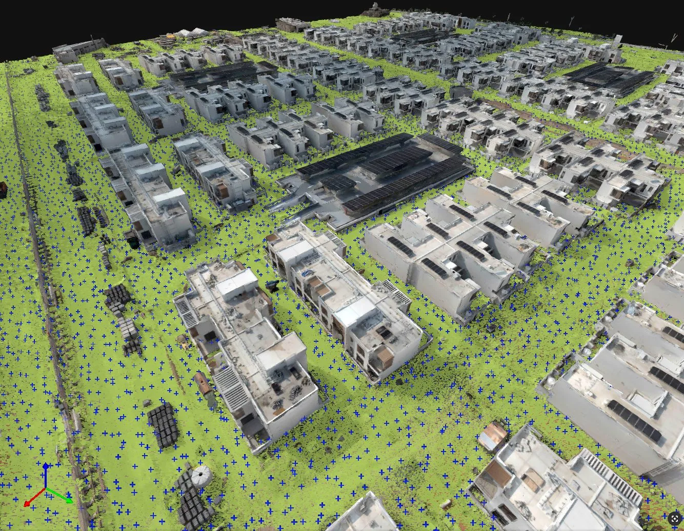 A dense green grid of terrain sample points surrounds buildings in a reconstructed site model