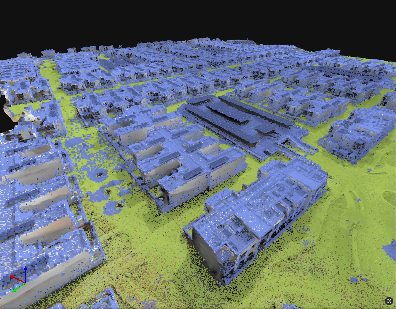 A site point cloud distinguishes ground surfaces from buildings using green and blue classifications