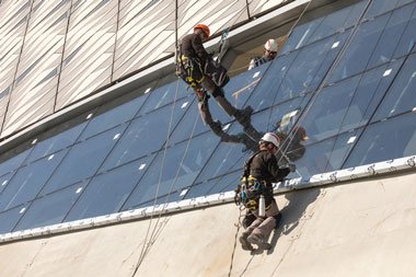 Drone conducting a facade inspection of a Dubai high-rise tower