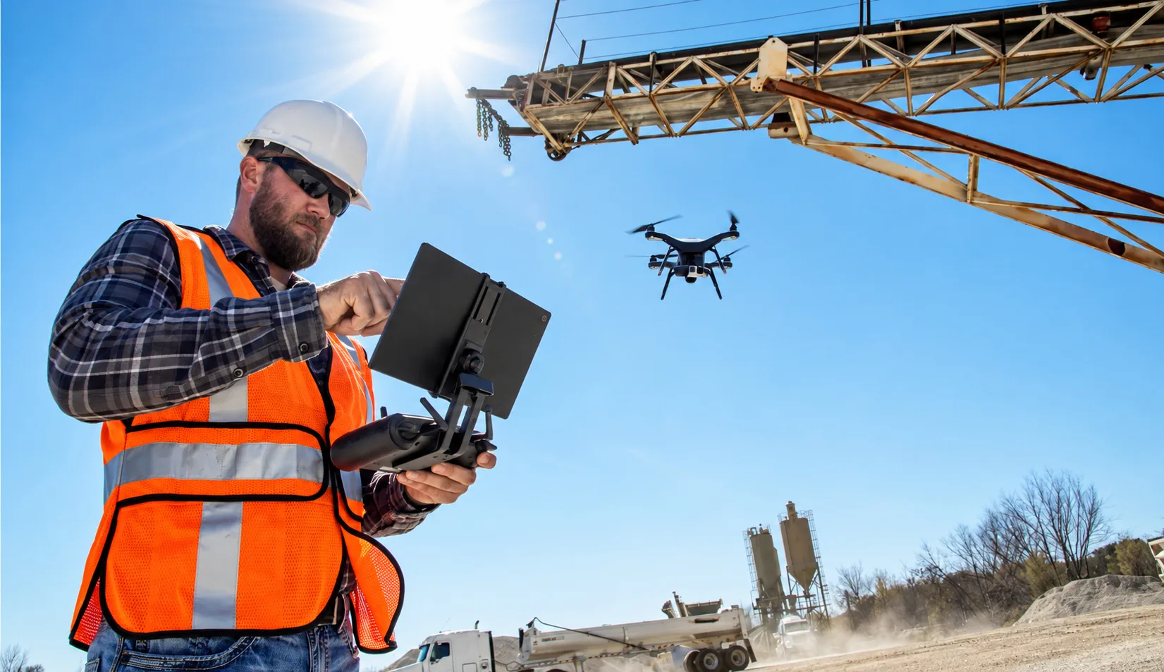 Drone operator flying a capture mission at an industrial yard