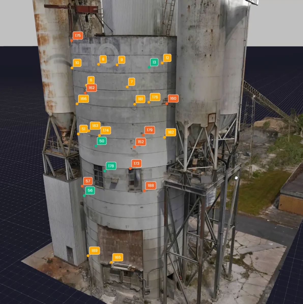 3D model of an industrial silo structure with numbered defect tags marking inspection points across the surface