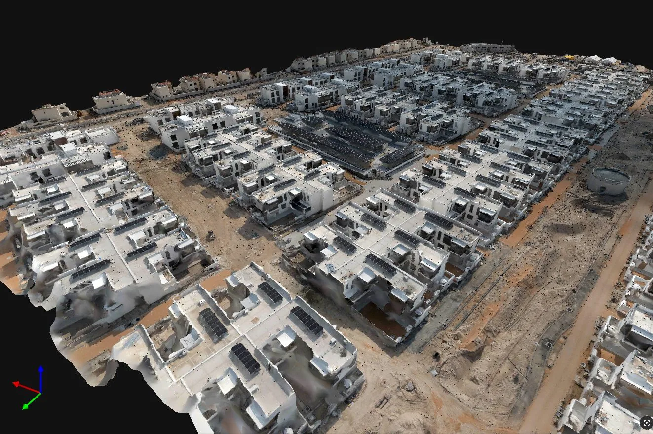 A textured photogrammetry mesh shows building geometry and road layout across a residential site